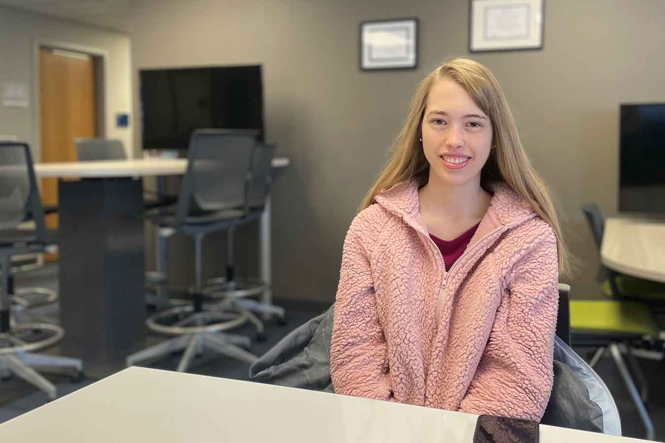 Christine Vogel sitting at a table