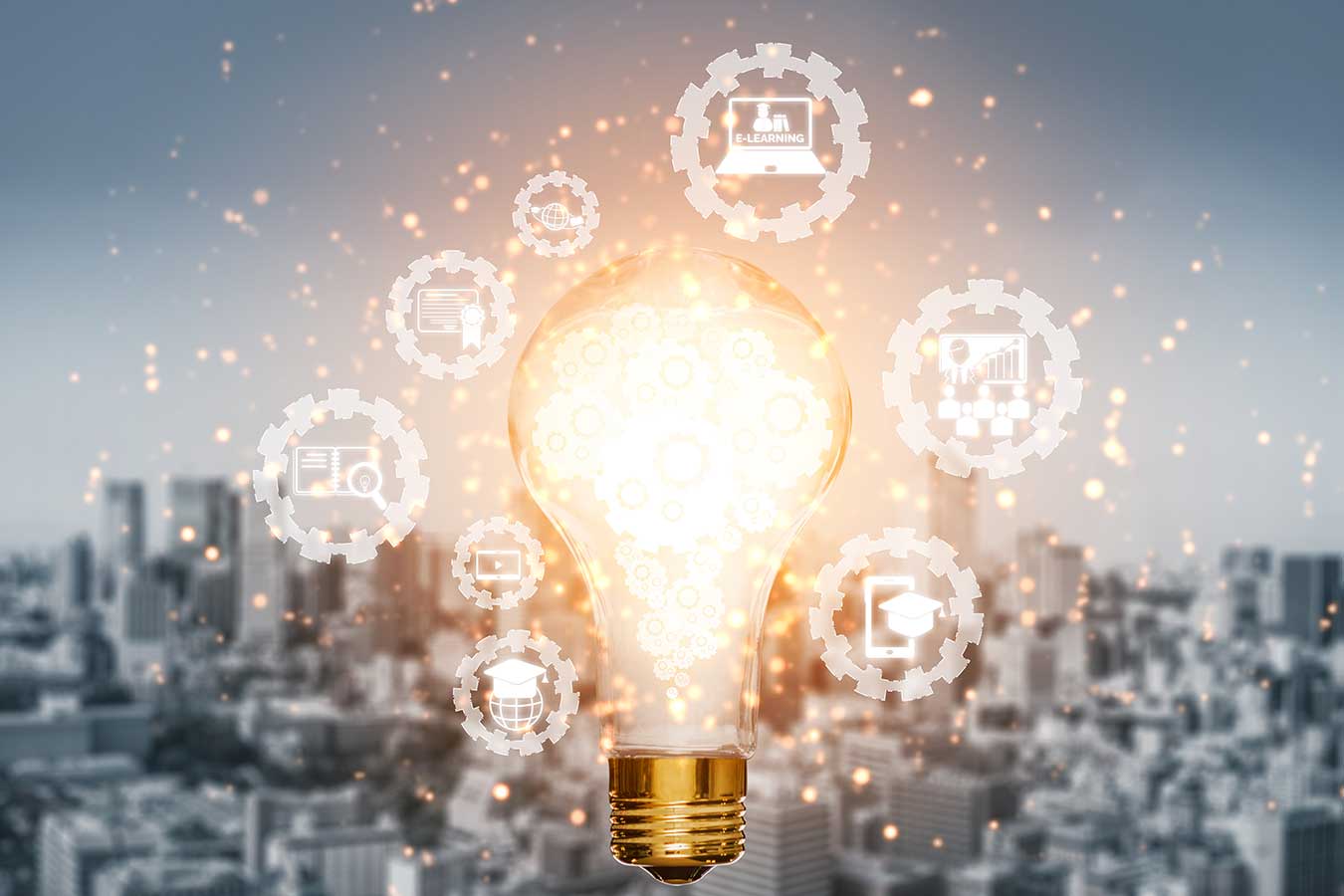 An image of a lightbulb overlaid on a photo of a city and small circles surrounding it.