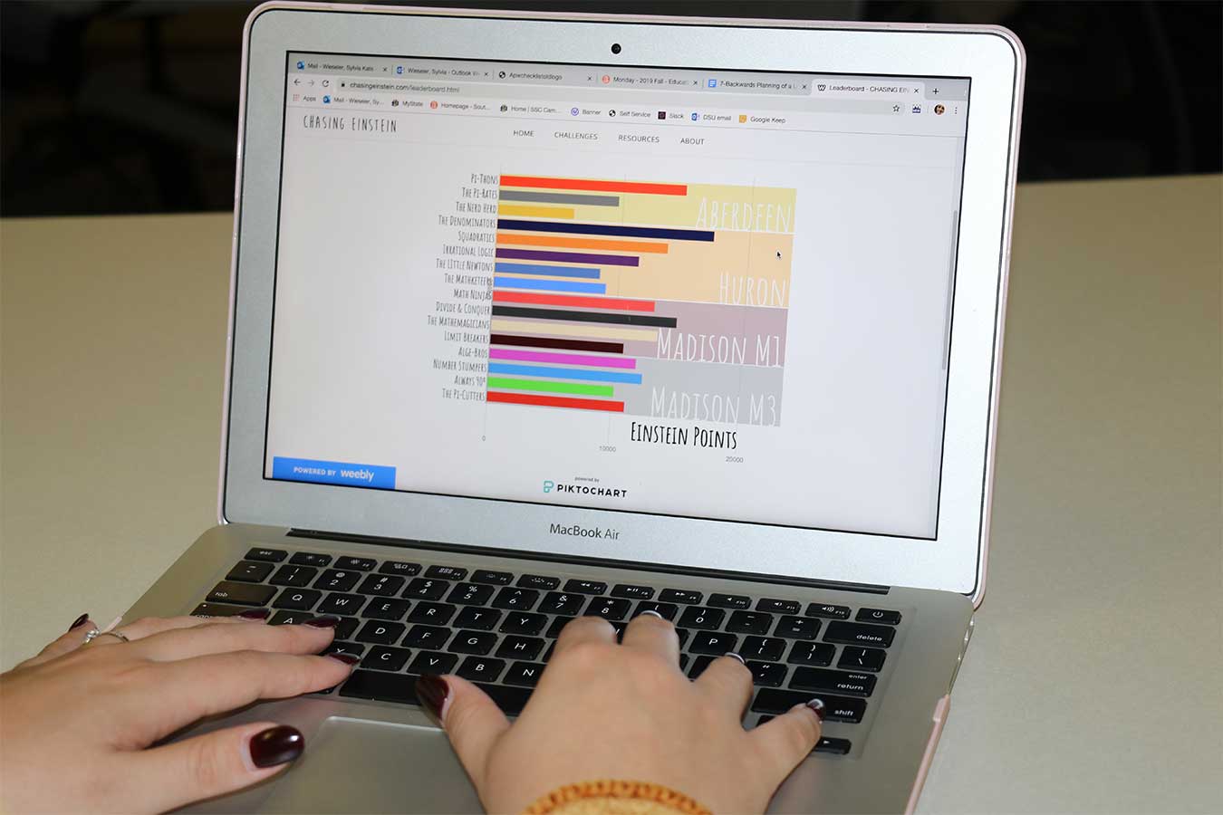 hands on a laptop computer