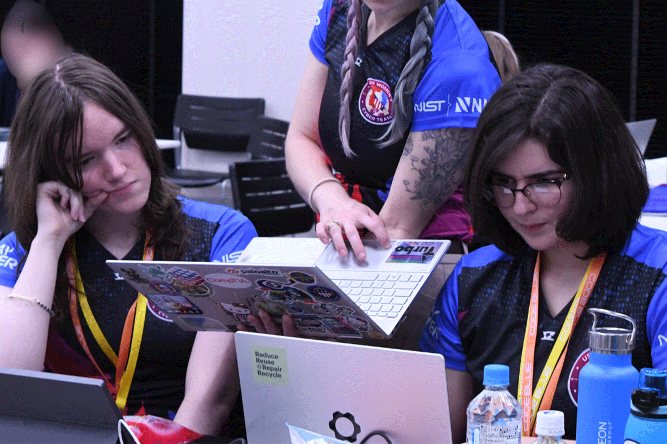 cyber competitors thinking at a computer