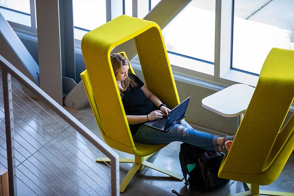 students studying in yellow pod